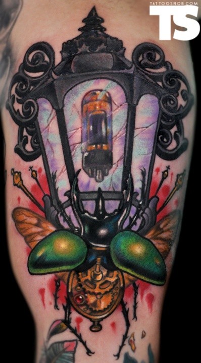 Nice 3D like antic street lighter with modern lamp tattoo on shoulder