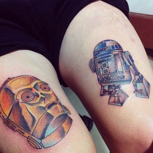 Nice 3D like detailed C3PO and R2D2 droids tattoo on thigh