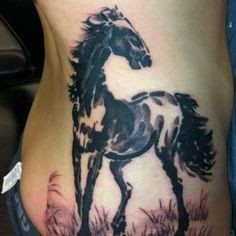 Nice asian style dark horse tattoo on ribs