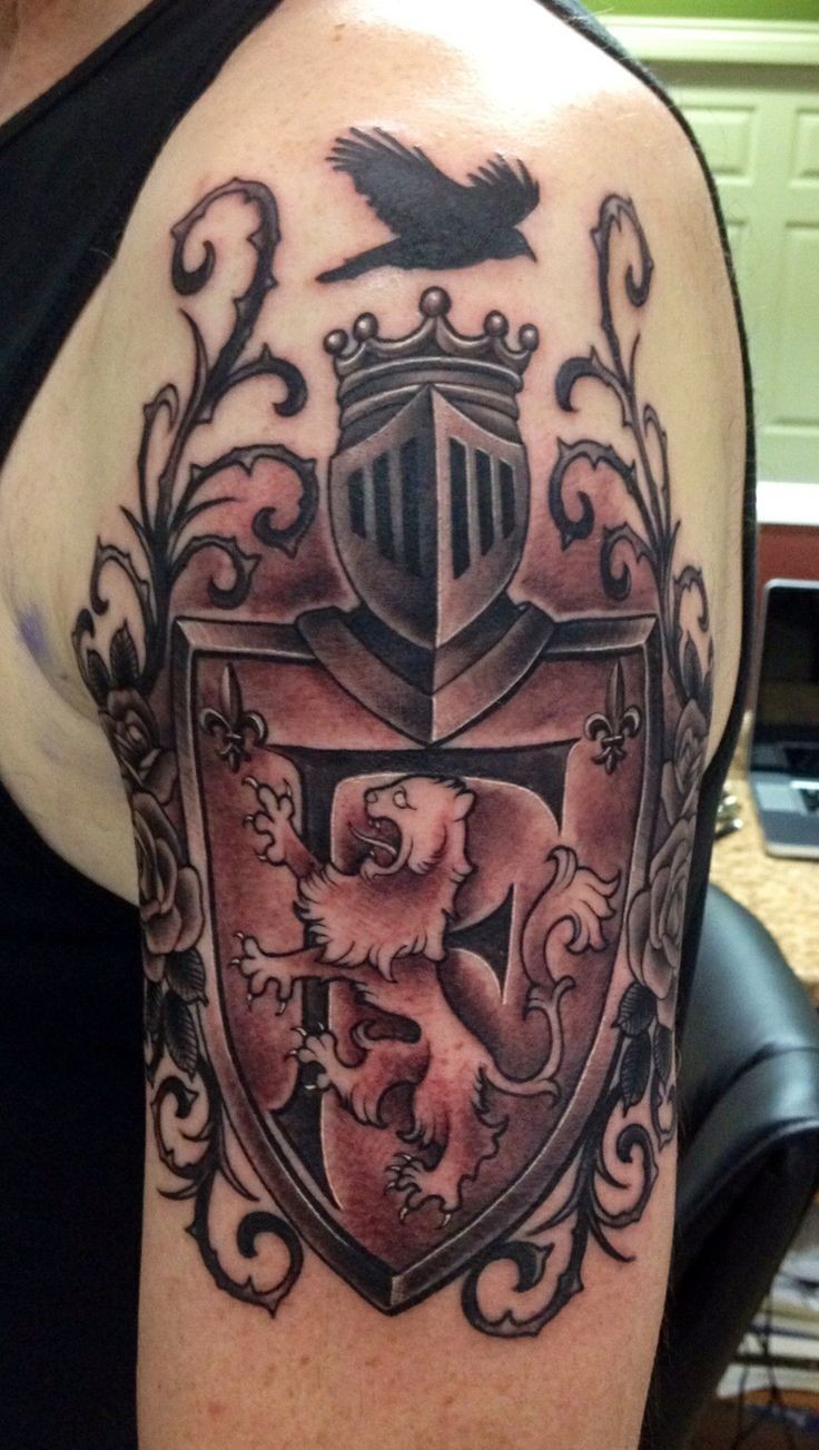 Nice black and white England native family crest tattoo on shoulder