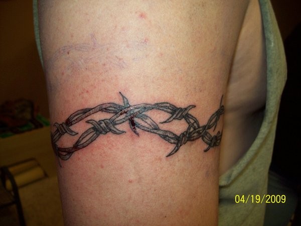 Nice black barbed wire armband tattoo