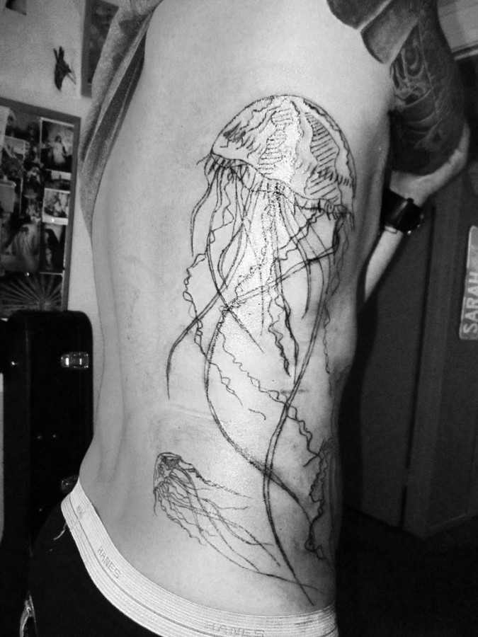 Nice black jellyfish tattoo on ribs