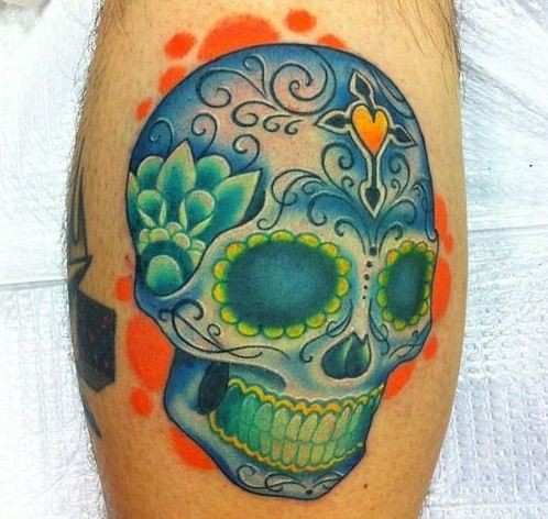 Nice blue green sugar skull tattoo