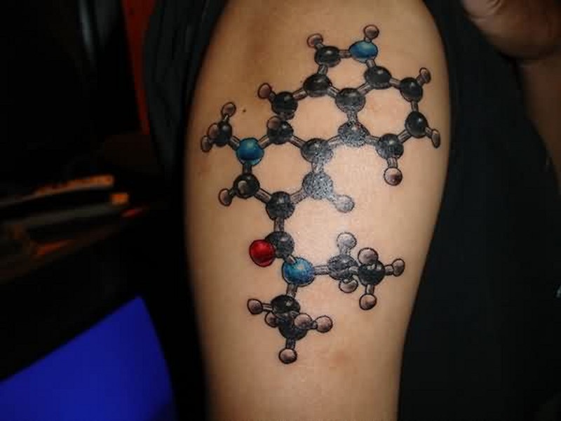 Nice colored shoulder chemistry themed tattoo