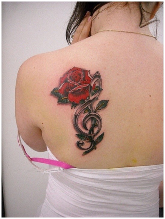 Nice combined big red rose with music note tattoo on shoulder