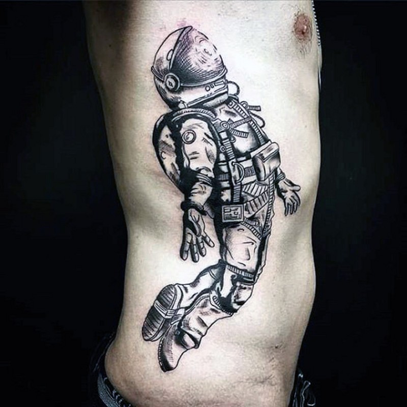 Nice detailed big black and white space man tattoo on side