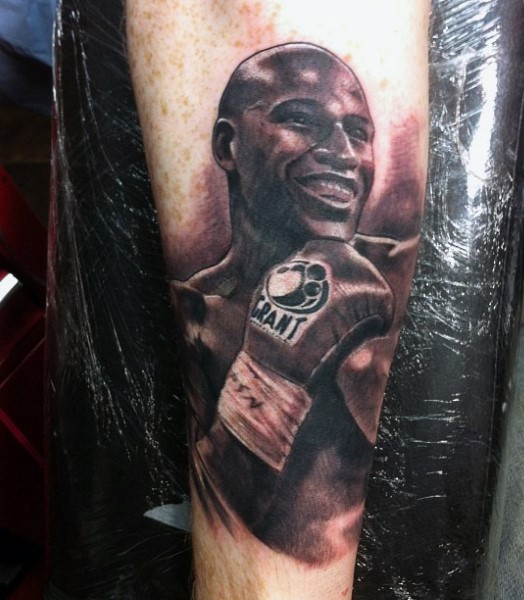 Nice detailed black ink famous boxer portrait tattoo on arm