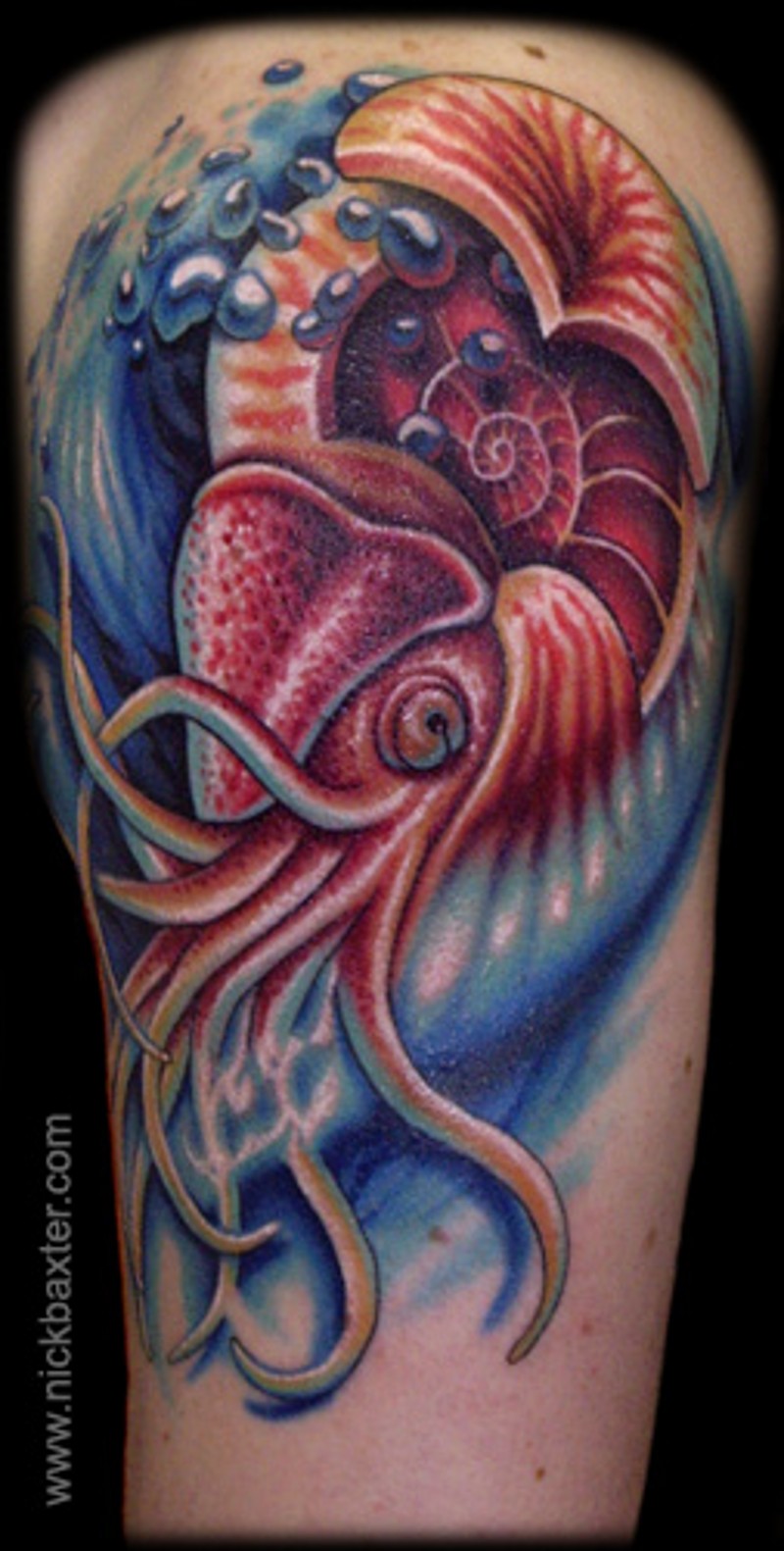 Nice detailed multicolored leg tattoo of cool squid in waters
