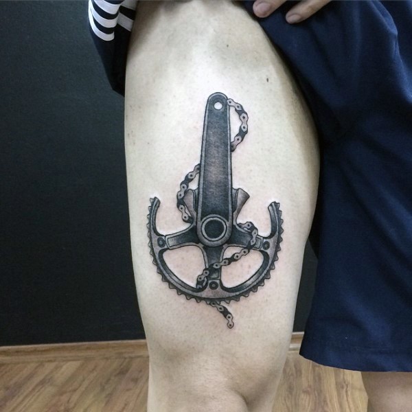 Nice little black ink bicycle part tattoo on thigh