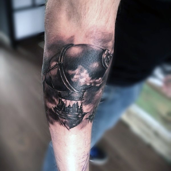 Nice looking black and gray style forearm tattoo of antic balloon with people