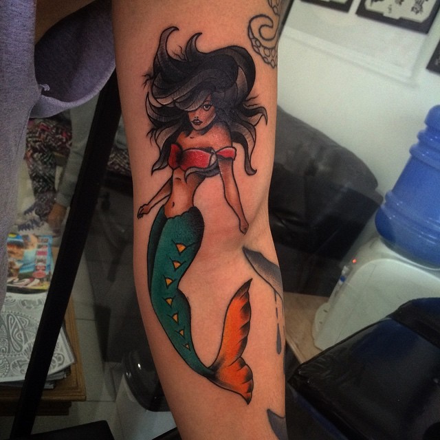 Nice looking colored forearm tattoo of seductive mermaid