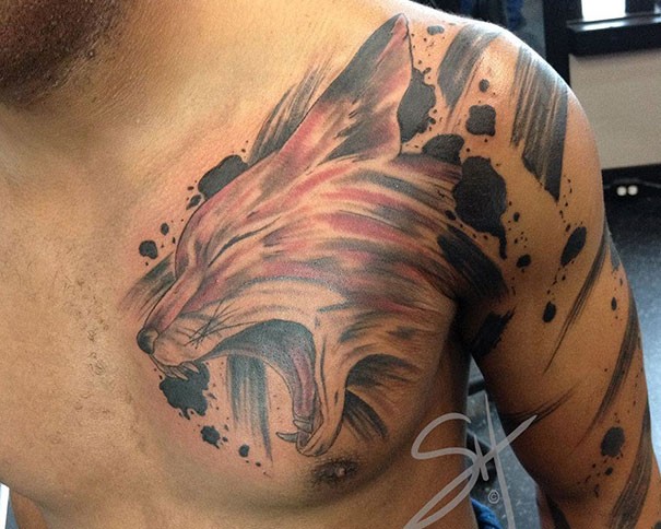 Nice looking colored illustrative style chest tattoo of fox head