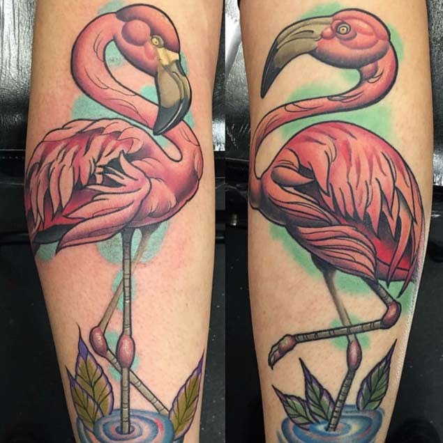 Nice looking colored pink flamingos tattoo on legs
