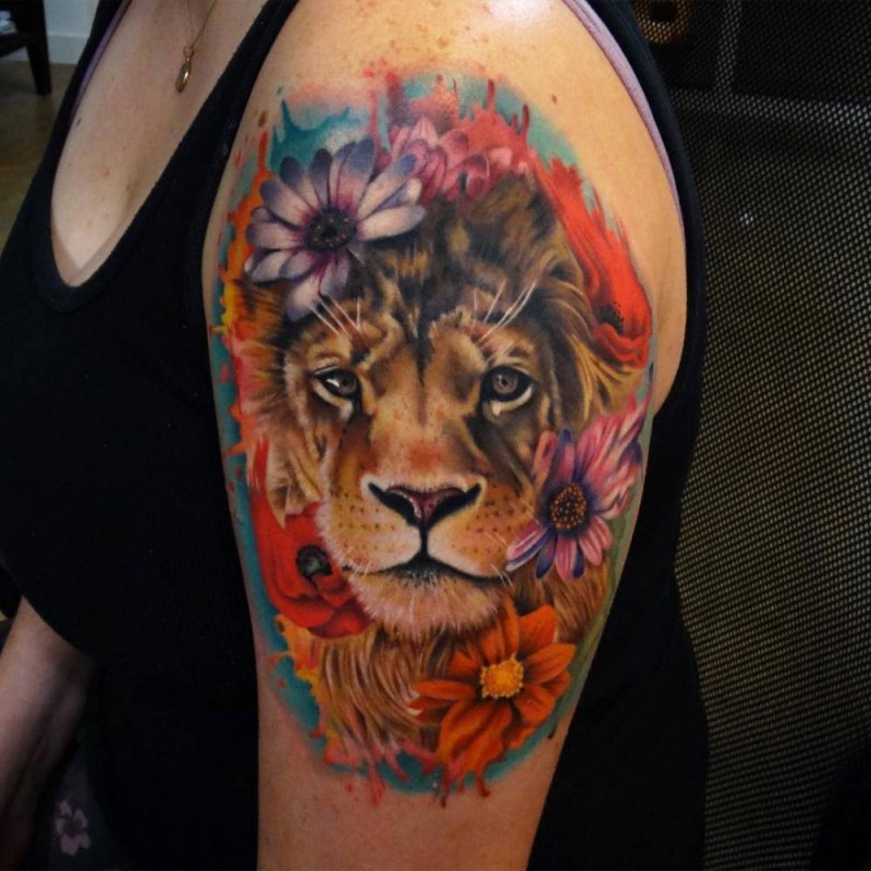 Nice looking colored shoulder tattoo of lion with flowers
