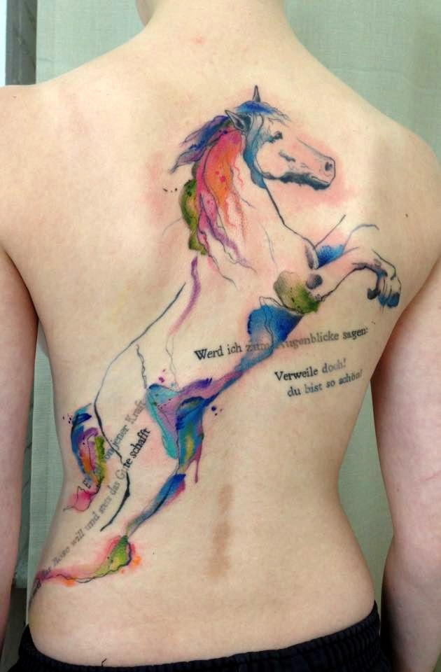 Nice looking colored whole back tattoo of big horse with lettering
