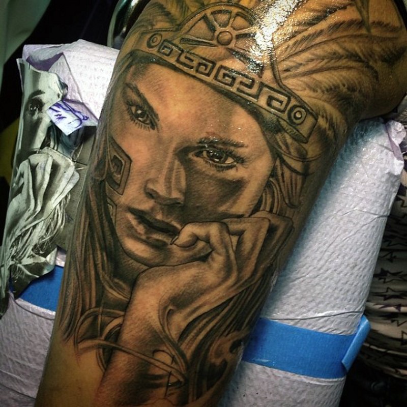 Nice looking detailed arm tattoo of beautiful tribal woman portrait