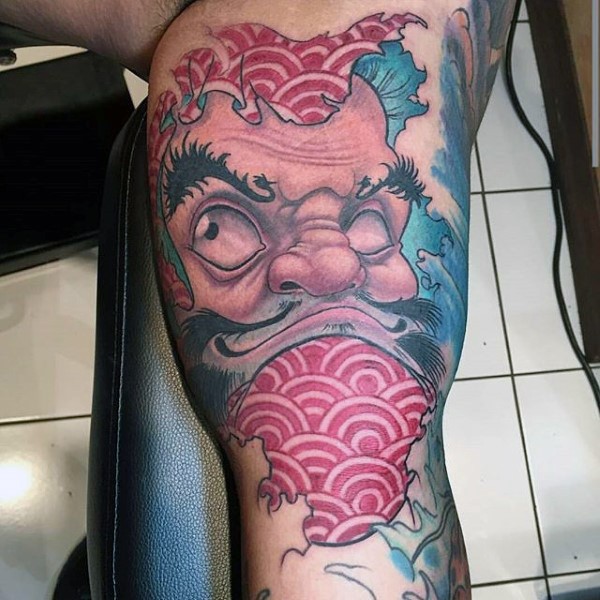 Nice looking neo japanese style biceps tattoo of daruma doll with waves