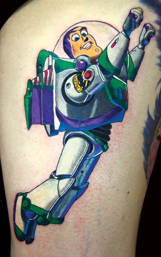 Nice painted and colored big thigh tattoo of Toy Story space soldier