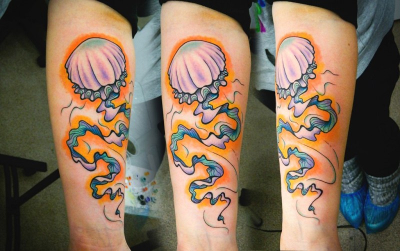 Nice painted big colored jelly-fish tattoo on arm