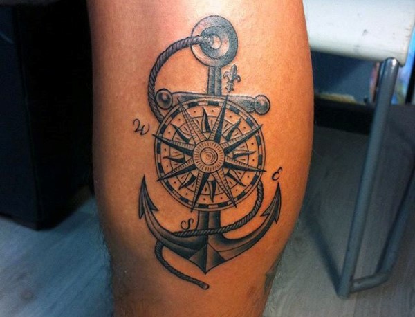 Nice painted detailed old roped anchor with compass tattoo on thigh