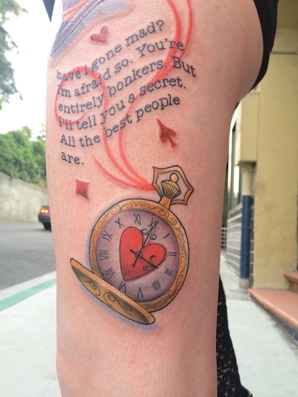 Nice painted little colored clock tattoo on thigh with lettering and hearts