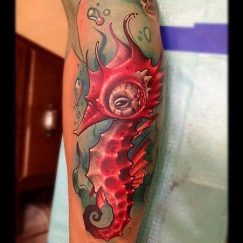 Nice red seahorse tattoo
