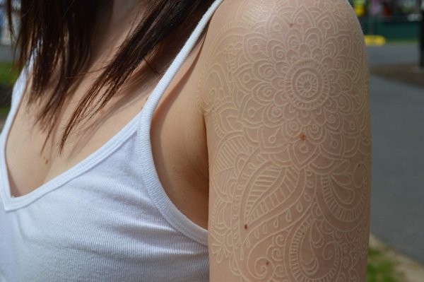 Nice white ink lace tattoo on shoulder
