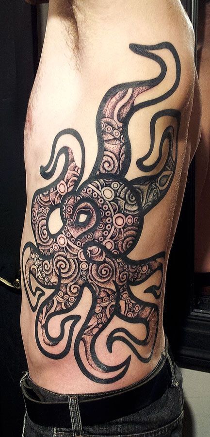 Octopus black ink tattoo on ribs