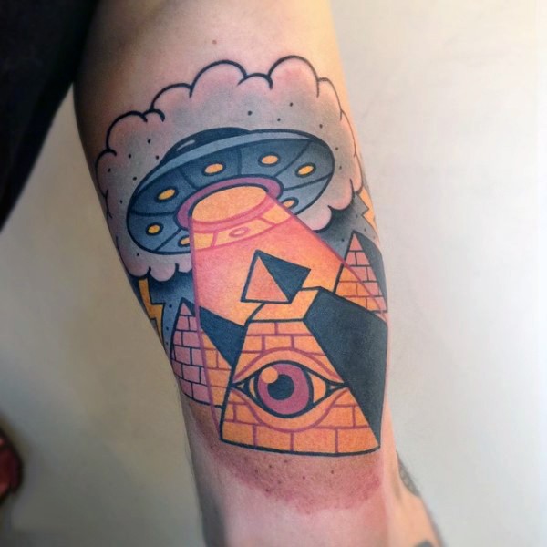 Old cartoon like alien ship with Masonic pyramid tattoo on arm