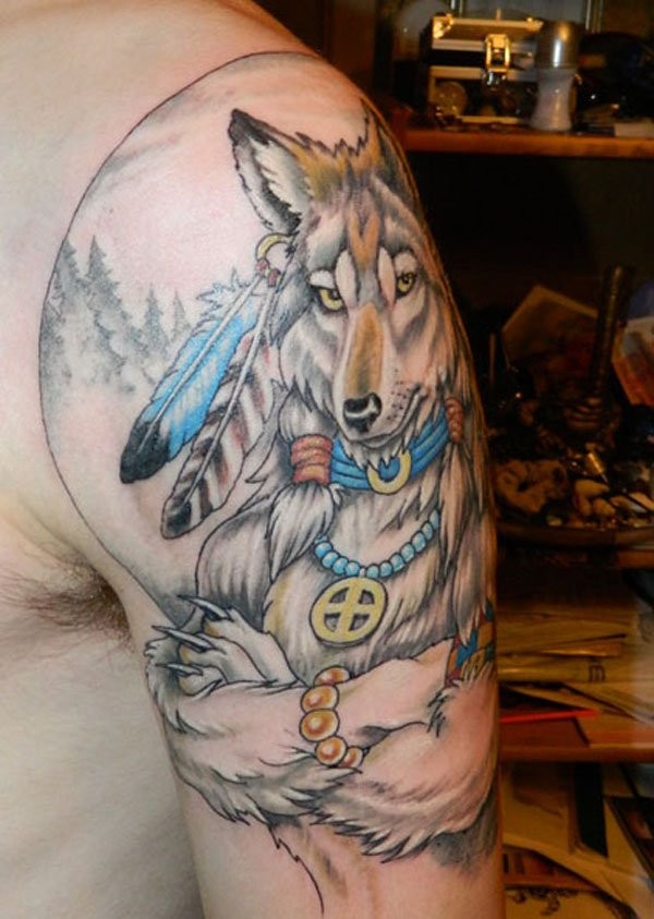 Old cartoon like colored shoulder tattoo of Indian wolf with feather