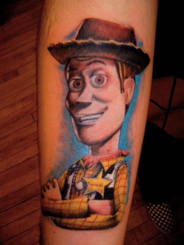 Old cartoon like colorful forearm tattoo of Cowboy form Toy Story cartoon