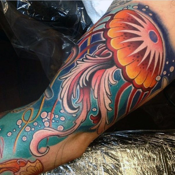 Old cartoon like colorful jellyfish shoulder tattoo