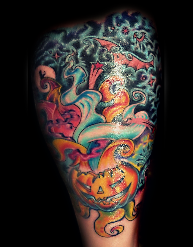 Old cartoon style colored Halloween themed tattoo on leg with bats and stars