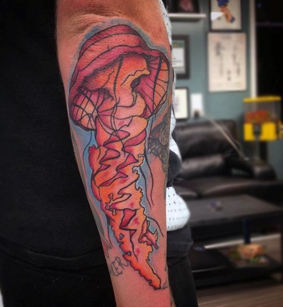Old cartoon style painted and colored jellyfish tattoo on arm