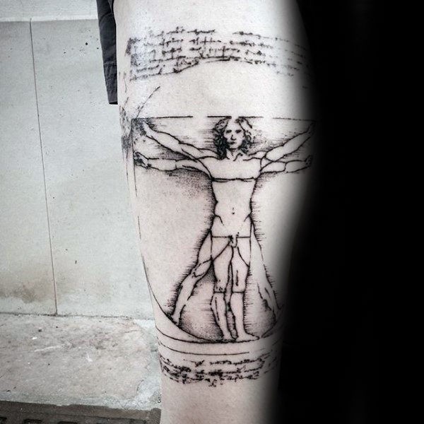 Old looking black ink arm tattoo of Vitruvian man with lettering