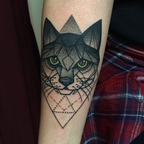 Old looking colored dot style cat tattoo on forearm