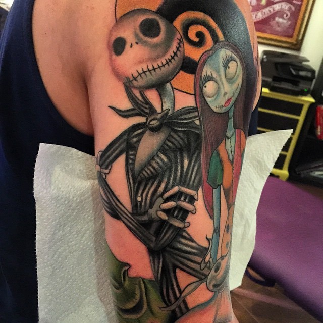 Old monster cartoon themed couple tattoo on shoulder