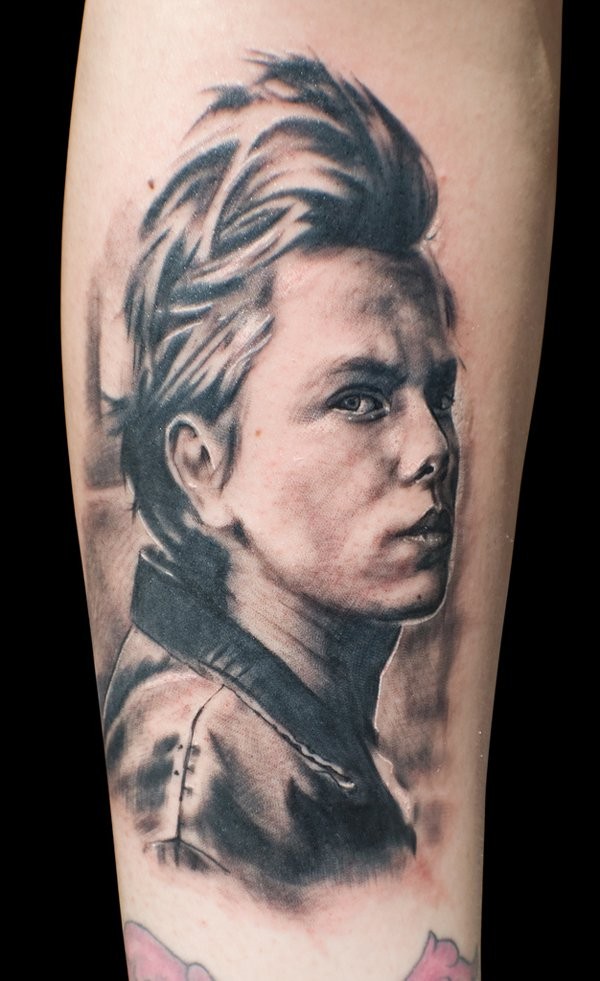 Old movie hero black and white realistic portrait tattoo on arm