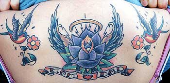 Old school back tattoo with birds, flower and wings in blue color