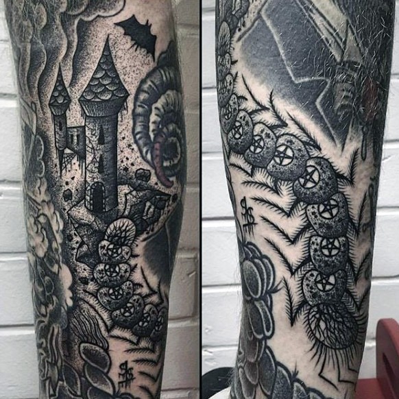 Old school black and white mystical castle tattoo on arm