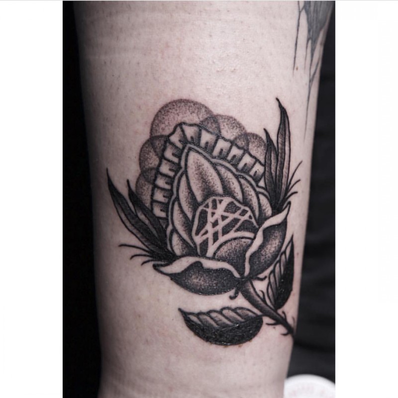 Old school black and white rose flower tattoo on wrist