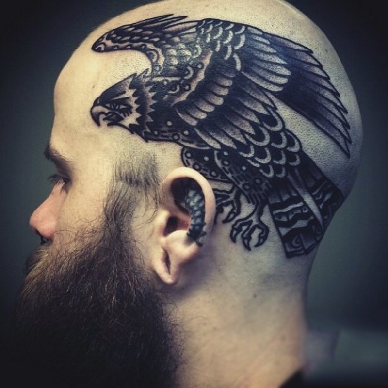 Old school black ink big eagle tattoo on head