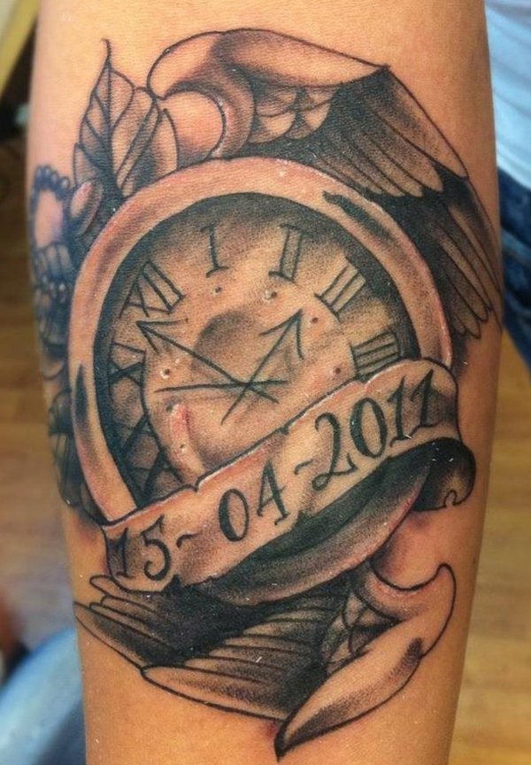 Old school black ink memorial clock tattoo on forearm with wings and date