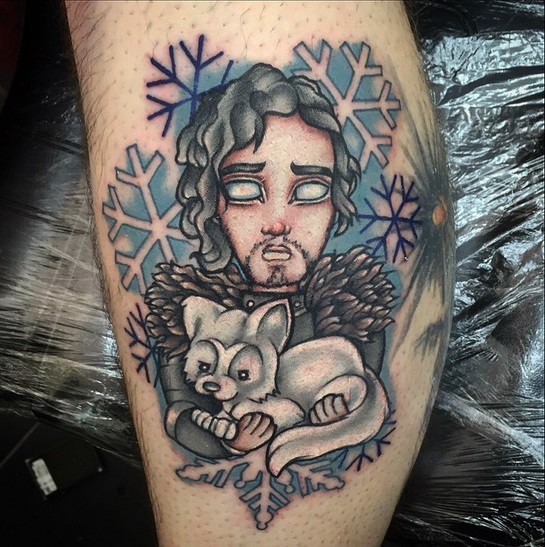 Old school cartoon like colored Game of Thrones hero tattoo on leg with little wolf