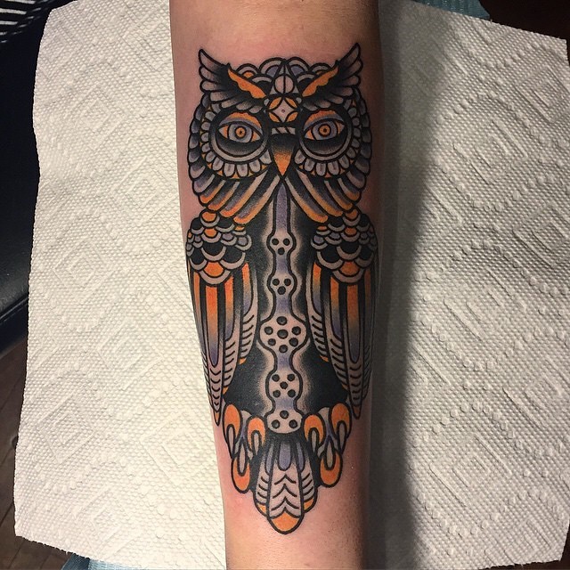 Old school colored and painted forearm tattoo of owl