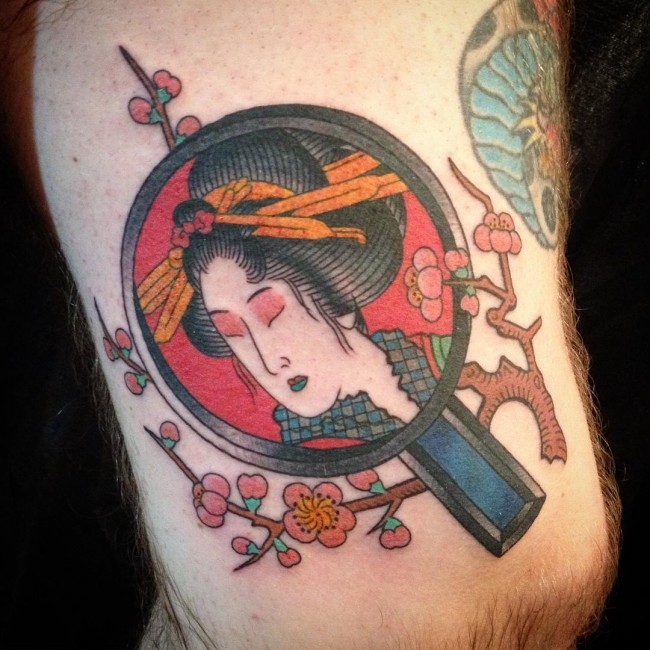 Old school Colored arm tattoo of geisha face in little mirror and flowers