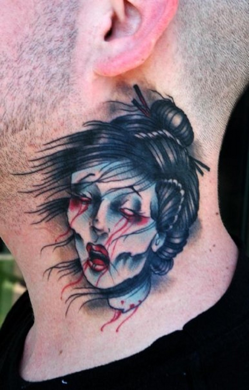 Old school colored bloody small severed head tattoo on neck