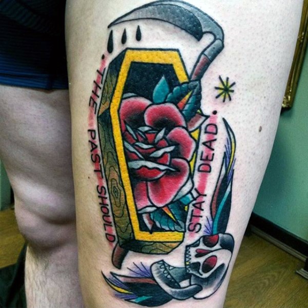 Old school colored coffin with skull, scythe and rose thigh tattoo with wise lettering