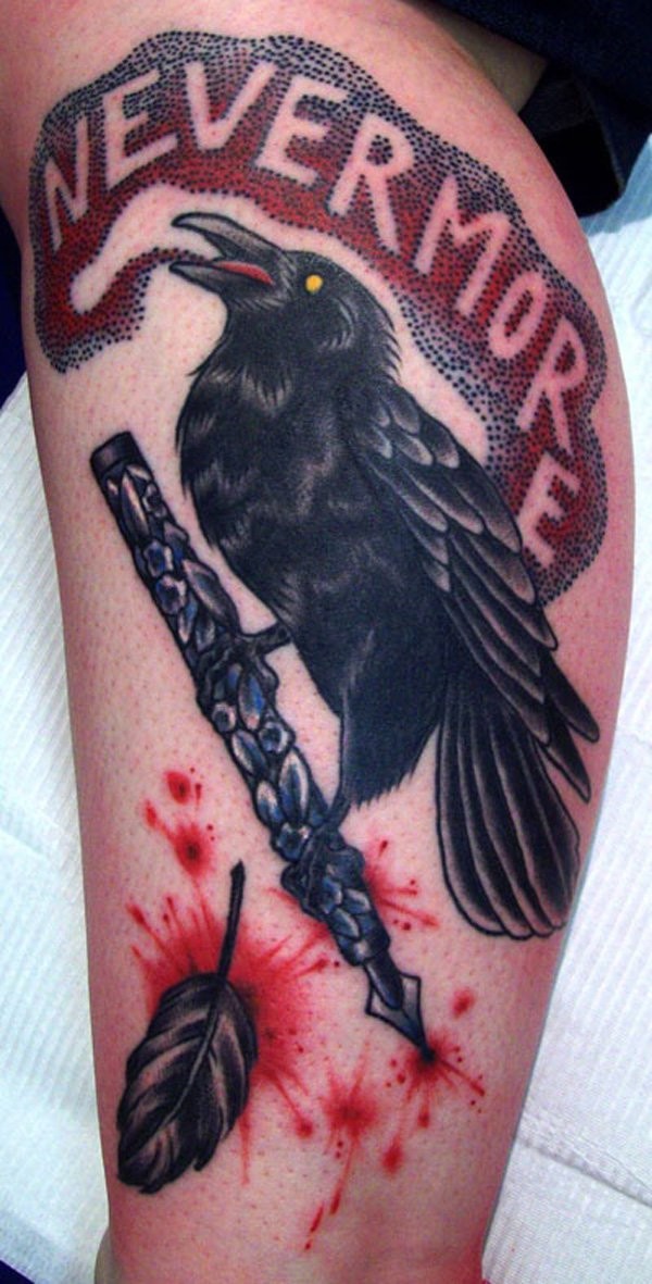 Old school colored crow with ink pen tattoo on leg stylized with letteirng