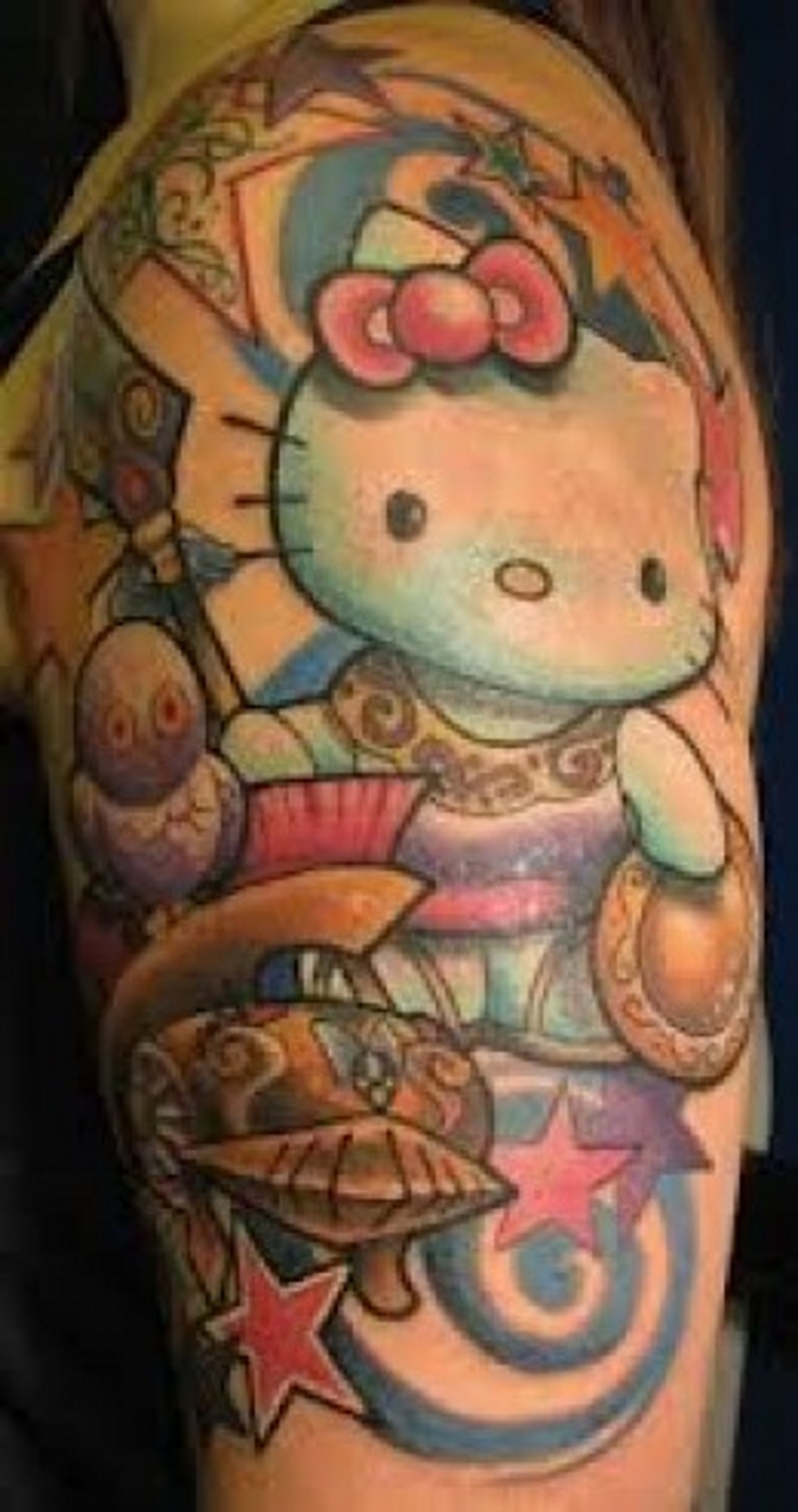 Old school colored funny colored hello kitty themed tattoo on shoulder stylized with stars